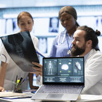 Medical professionals examine anatomy scans to develop effective treatment plan