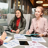 Women have a Finance meeting at cafe 