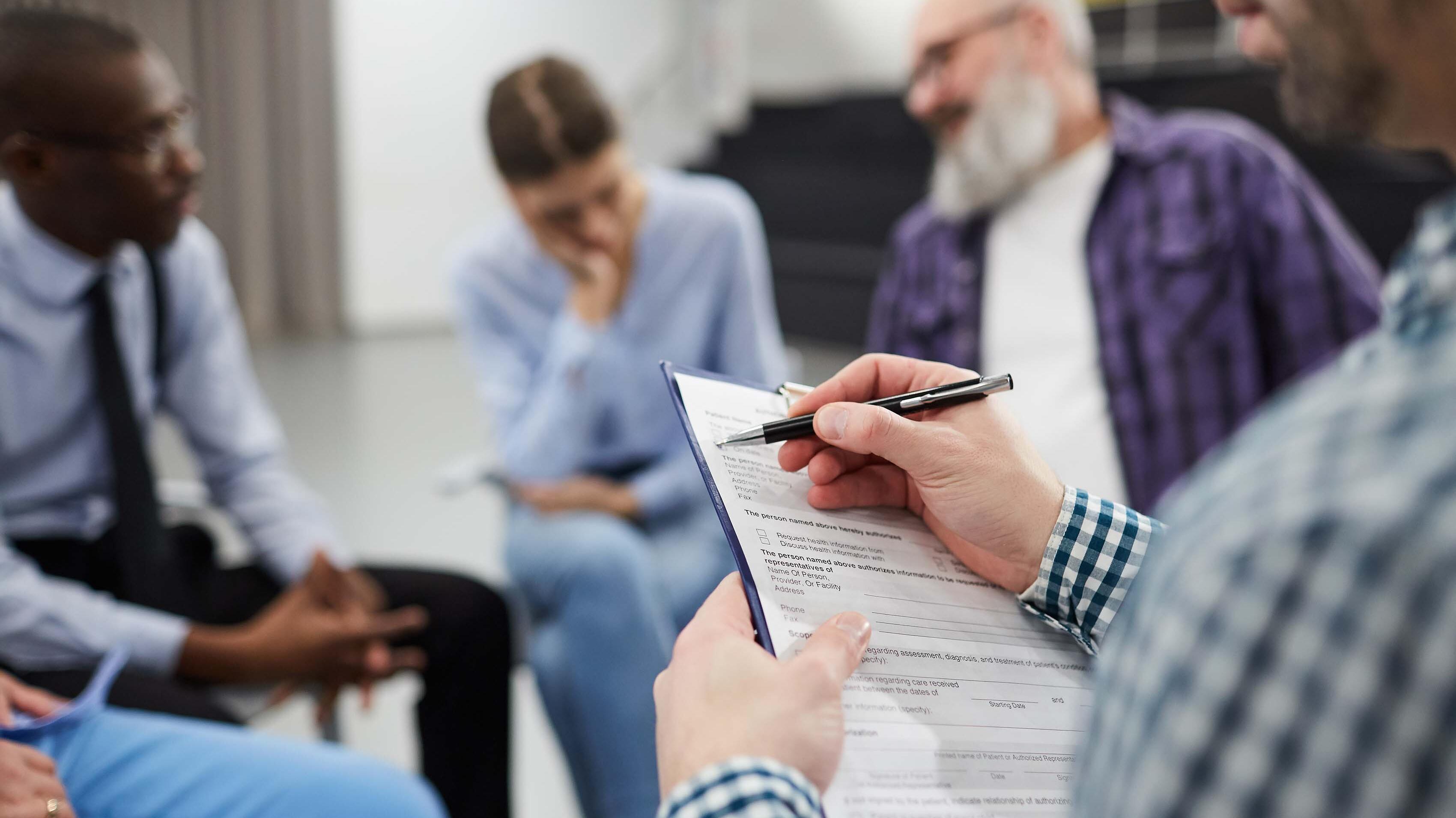 Closeup of Psychologist in Support Group - social work