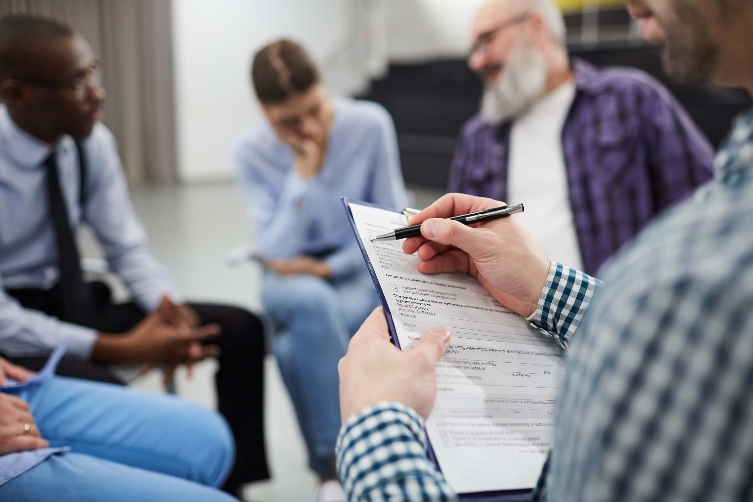 Closeup of Psychologist in Support Group - social work