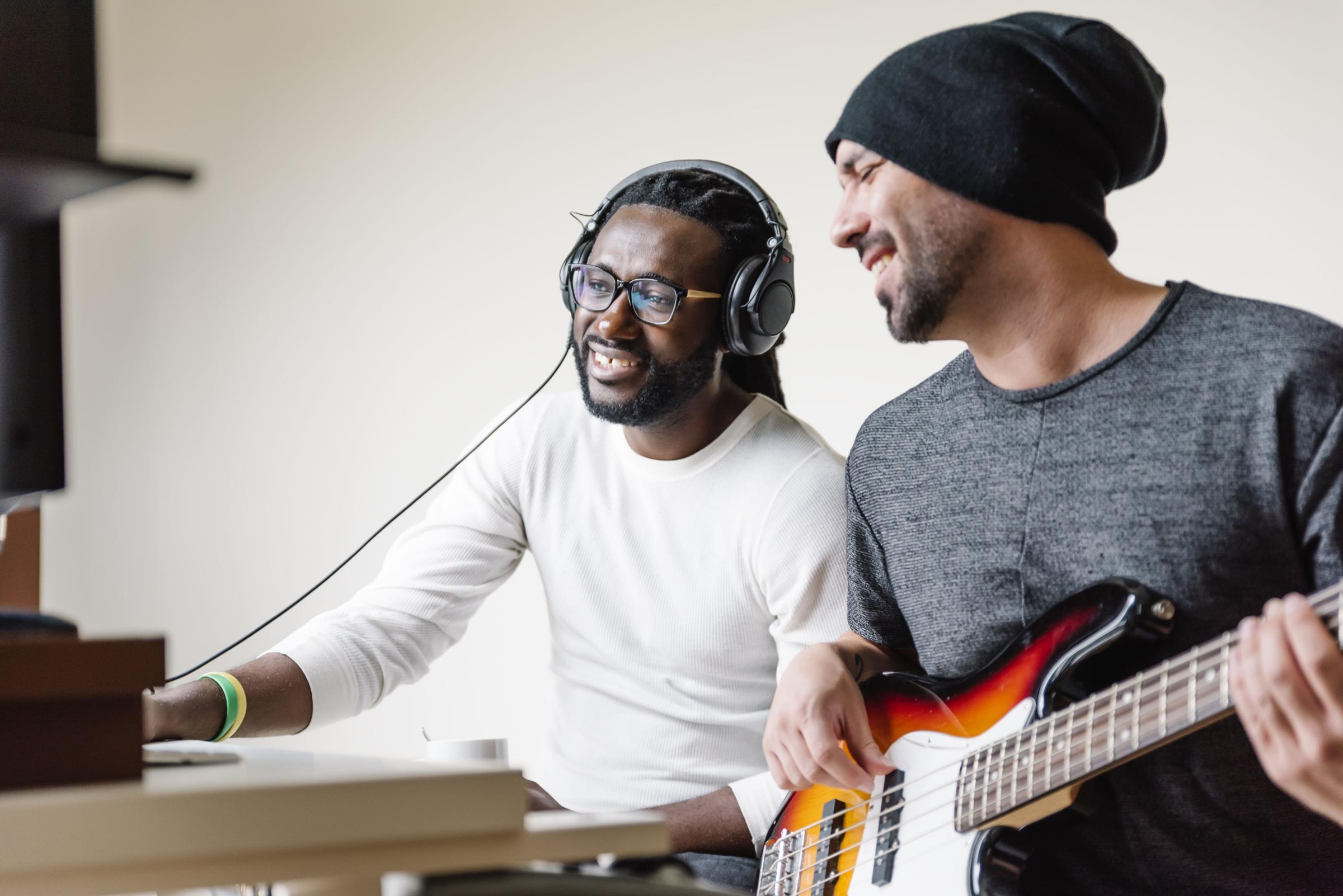 Artists producing music in their home sound studio